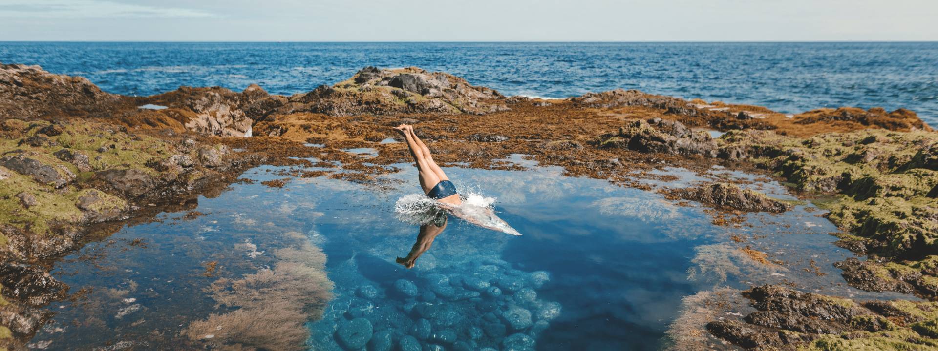 Diving into a rock pool