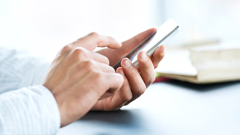 Smart phone in man’s hands