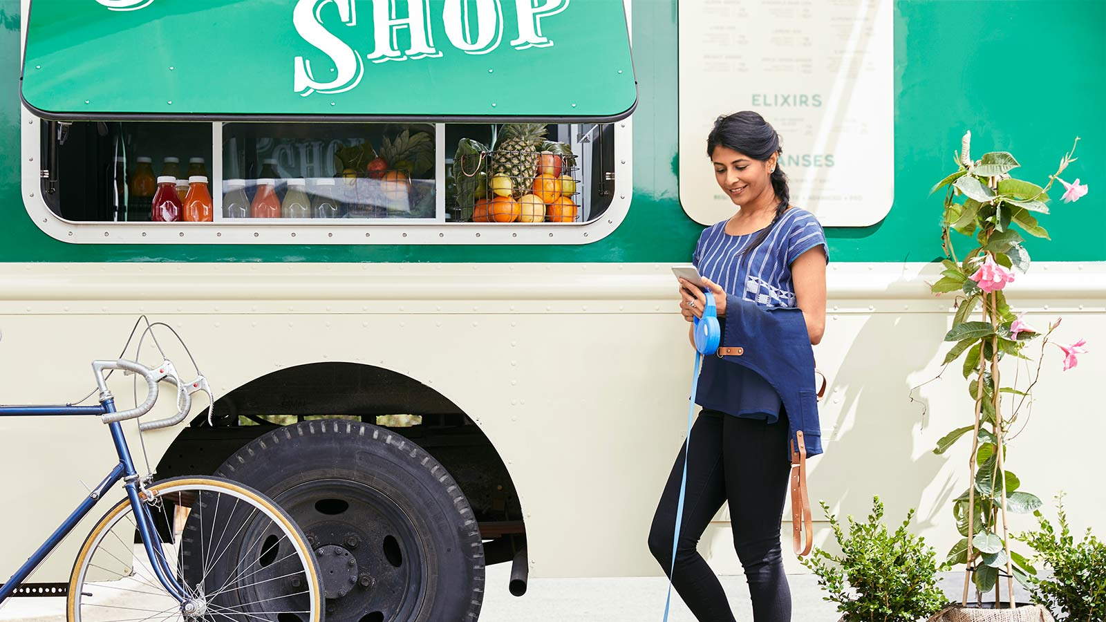 Woman standing at a mobile shop
